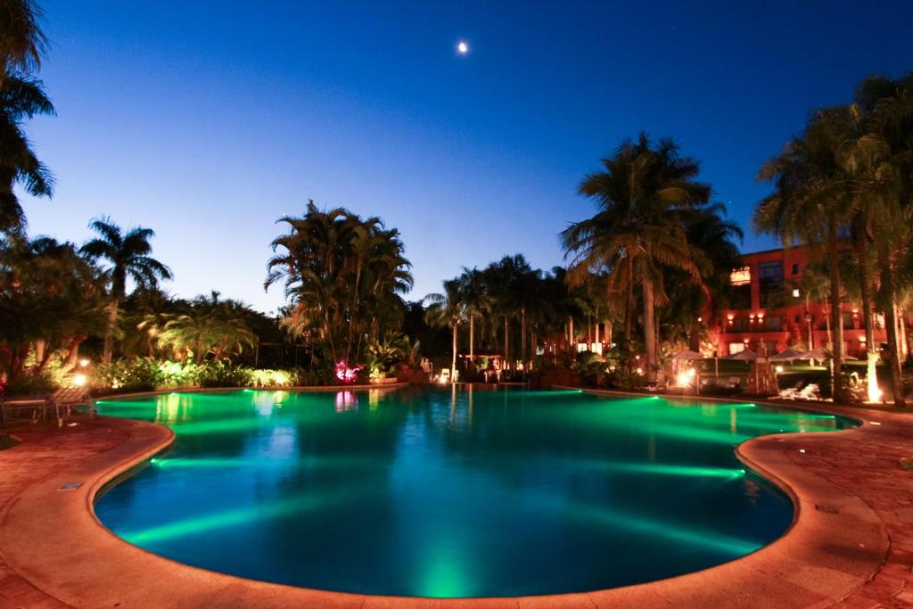 Beautiful view of the pool at the Iguazu Grand Hotel during a stunning sunset.