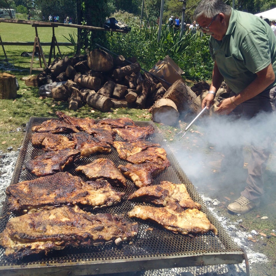 Argentinian gauchos cooking barbecue (asado).
