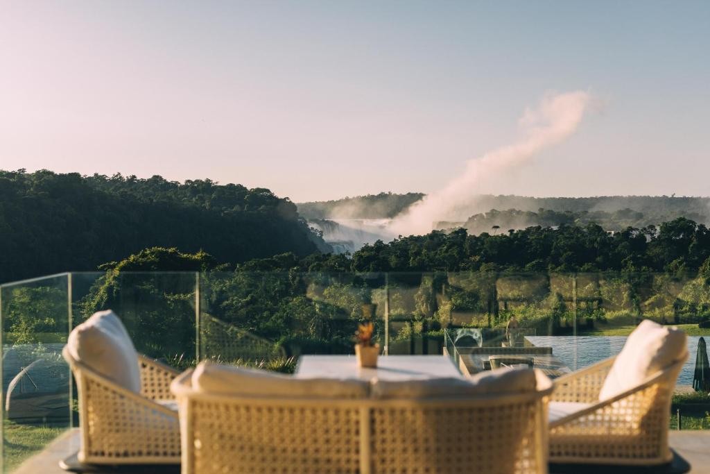 Pool view of the Melia hotel with the Iguazu Falls in the background.
